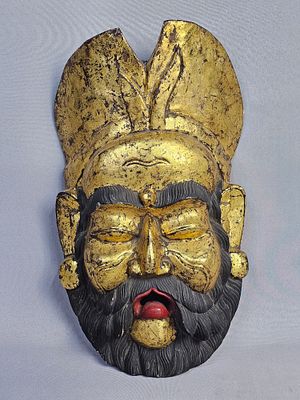 Large Balinese Wood Gold Leaf King Mask. Hand carved 20th century wooden wall mask in the 
