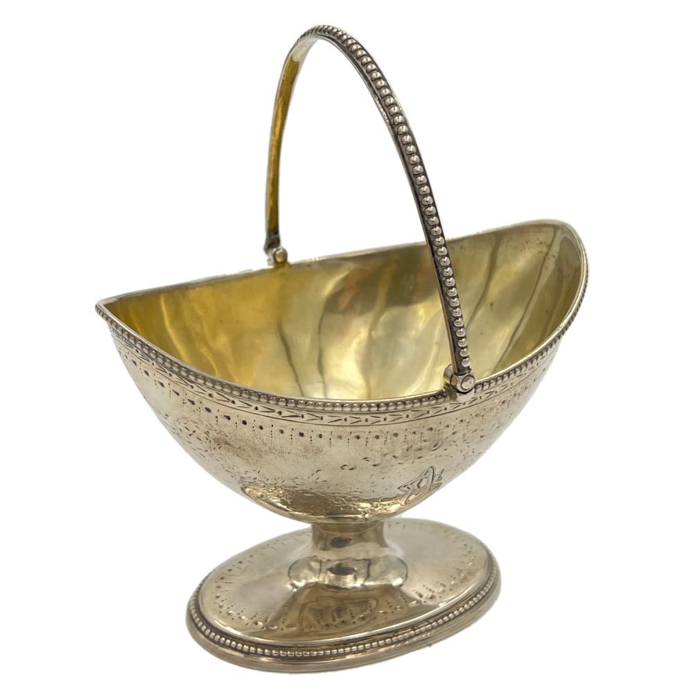 Lot 151: A GEORGIAN SILVER SWING HANDLE SUGAR BASKET RAISED...
