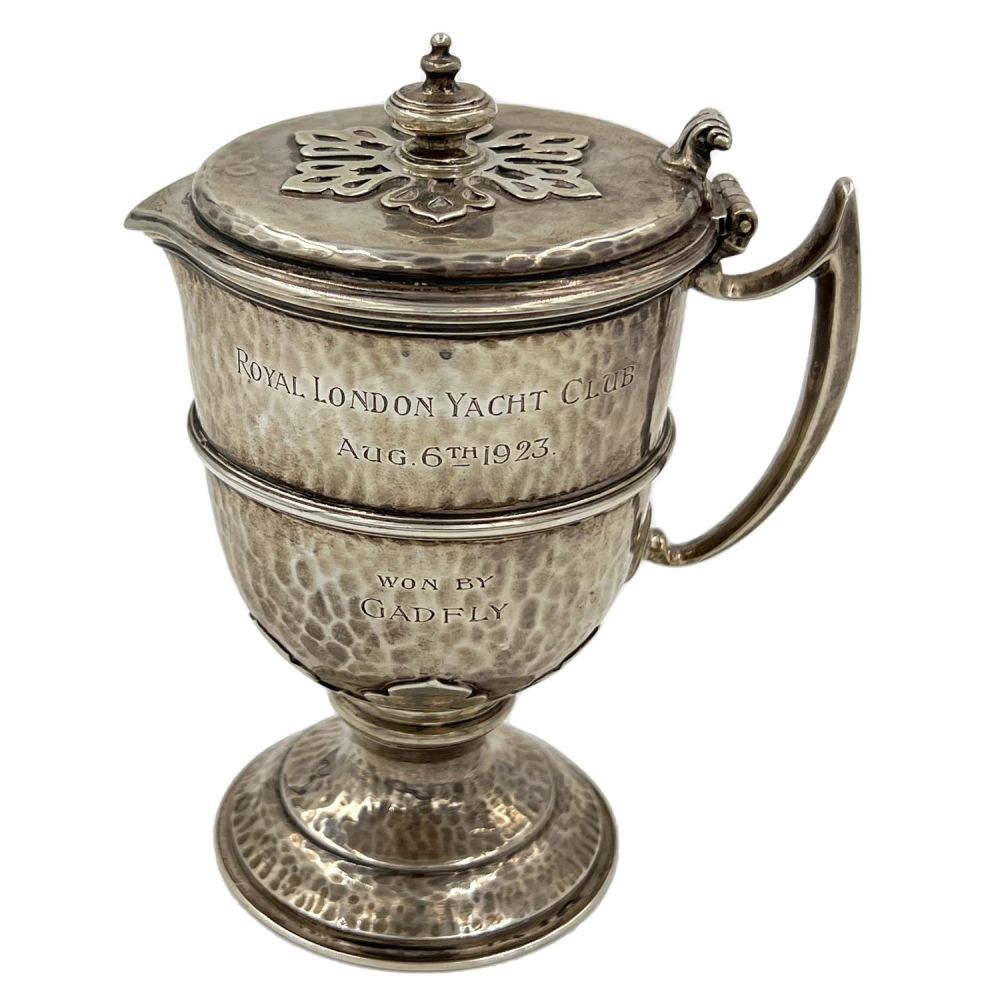 Lot 161: A SMALL VICTORIAN HAMMERED SILVER LIDDED FLAGON WITH...