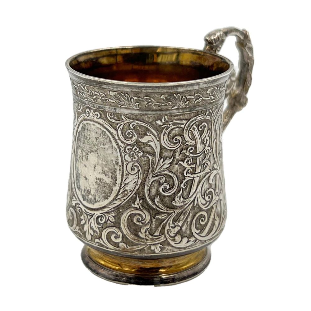 Lot 164: A MINIATURE SILVER TANKARD WITH EXTENSIVE EMBOSSED DECORATION,...
