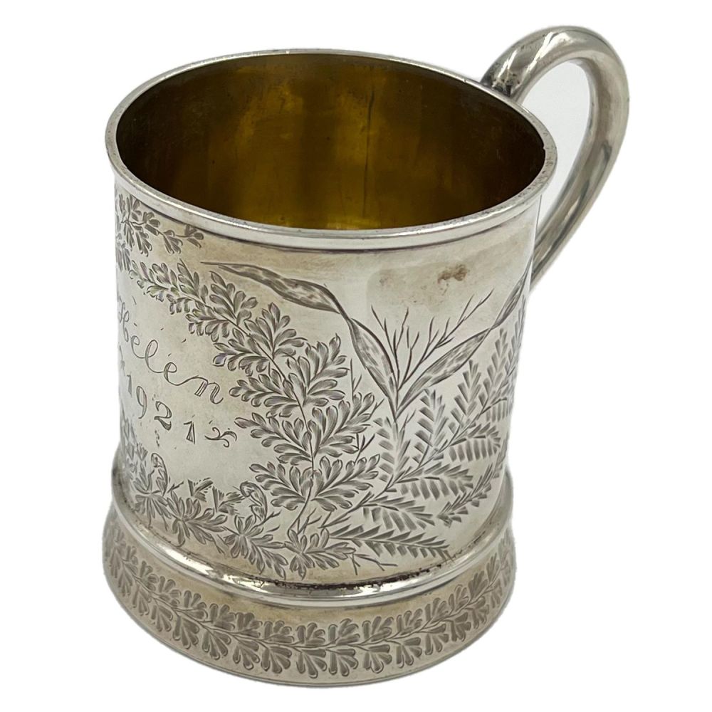 Lot 170: A LATE VICTORIAN SILVER CHRISTENING MUG WITH FOLIATE...