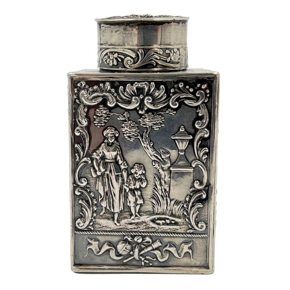 Lot 188: A SMALL SILVER LIDDED TEA CADDY EMBOSSED WITH...