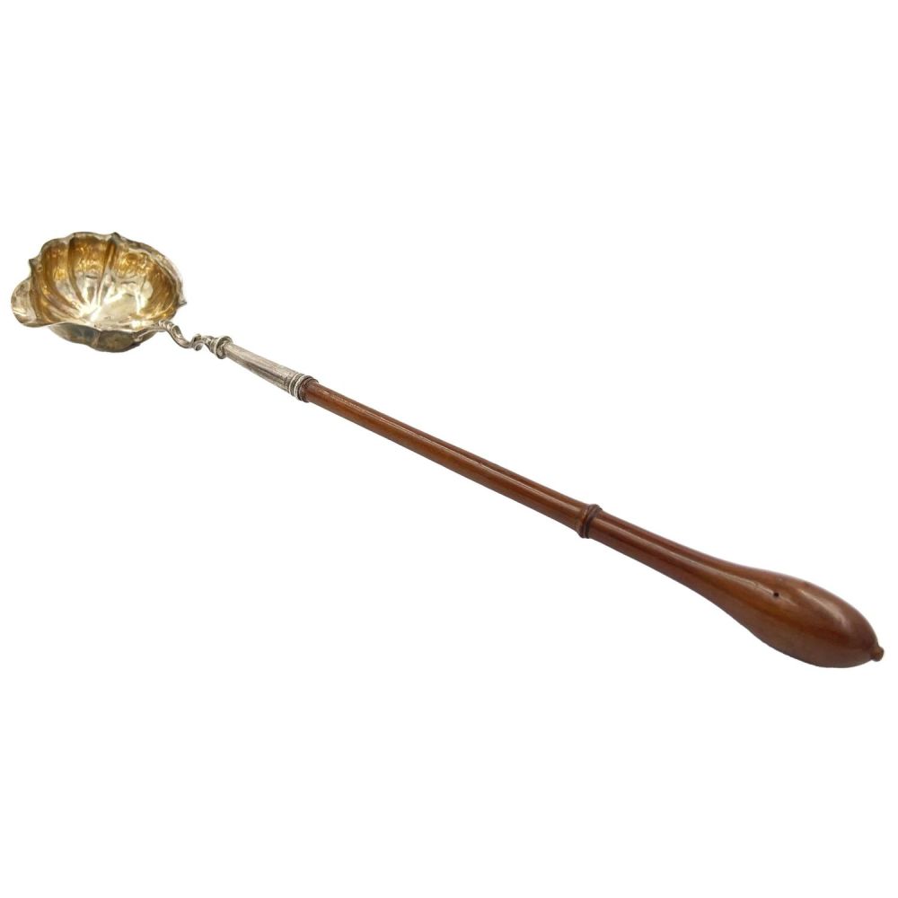 Lot 198: A GEORGIAN SILVER LADLE WITH TURNED WOODEN HANDLE,...