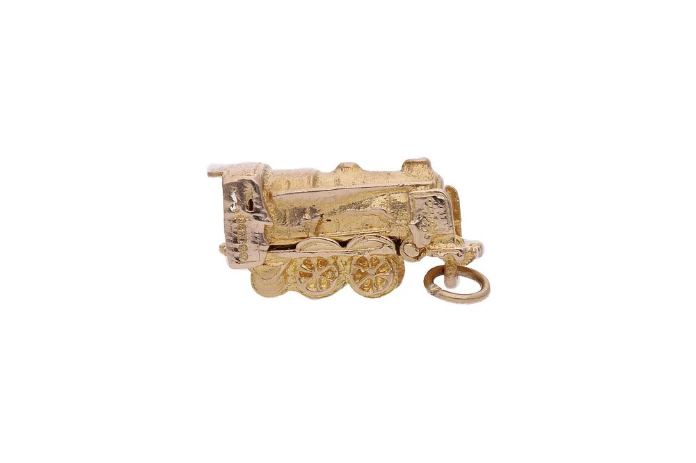 Lot 182: 9ct Gold Steam Engine Train Charm Opens to a " Bon Voyage" Message.