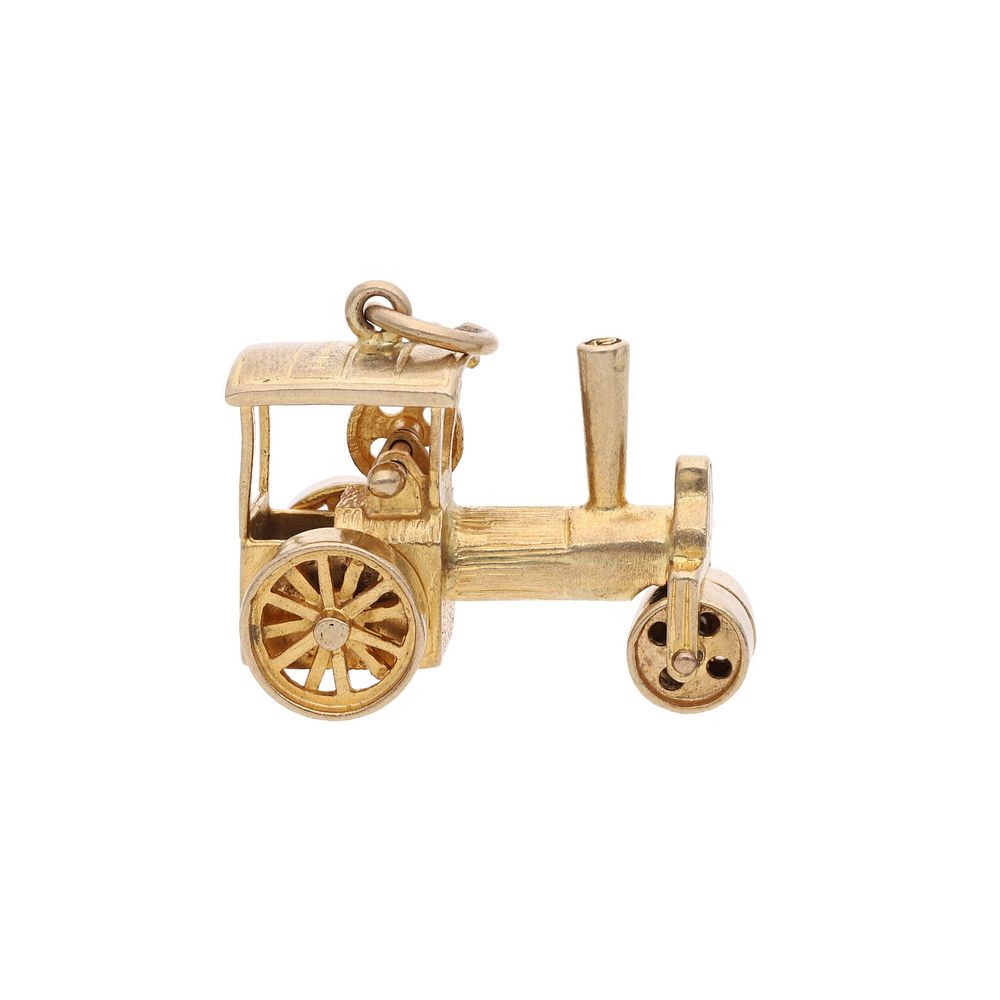 Lot 200: 9ct Gold Moving Tractor Charm.