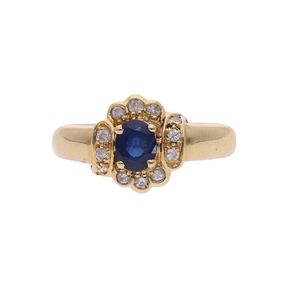 Lot 234: 18ct Gold Sapphire and Diamond Cluster Ring.
