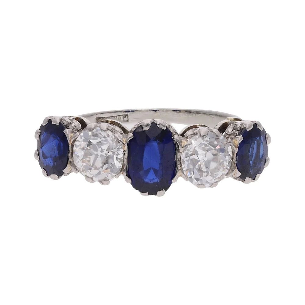 Lot 256: Platinum 18ct Gold Sapphire and Diamond Five Stone Ring.