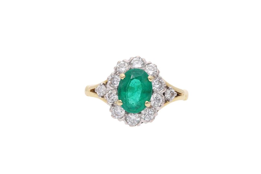 Lot 366: 18ct Gold Emerald and Diamond Cluster Ring.
