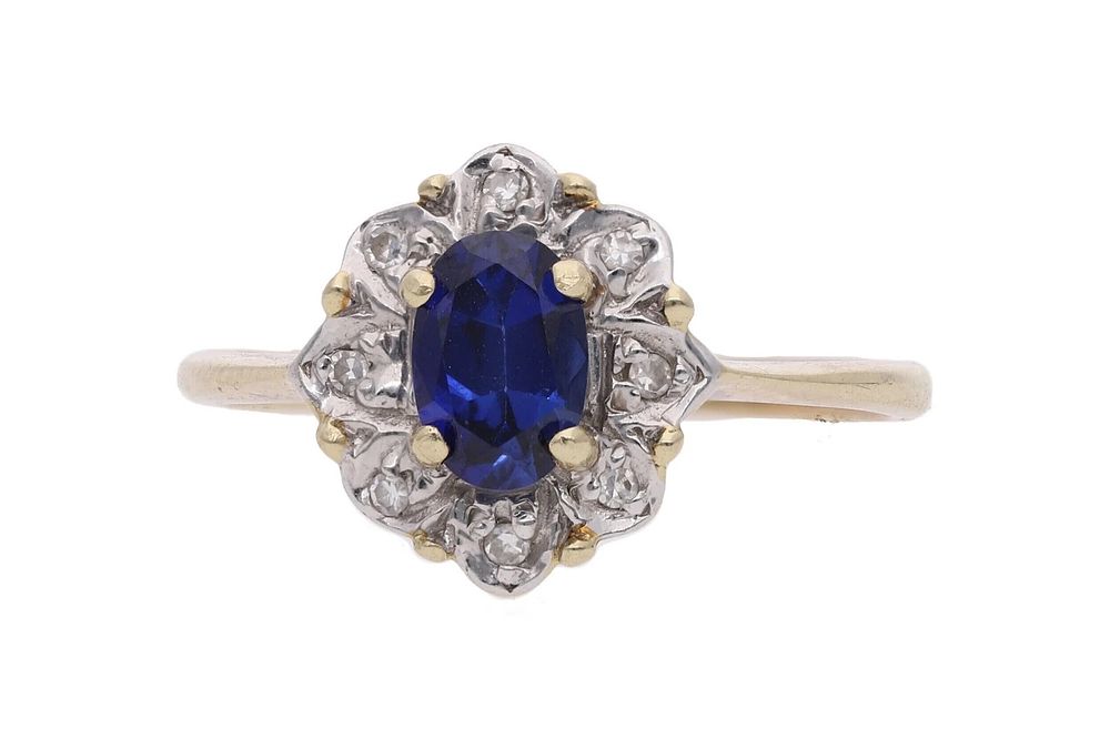 Lot 370: 9ct Gold BlueSynthetic Sapphire and Diamond Cluster Ring, Size K.