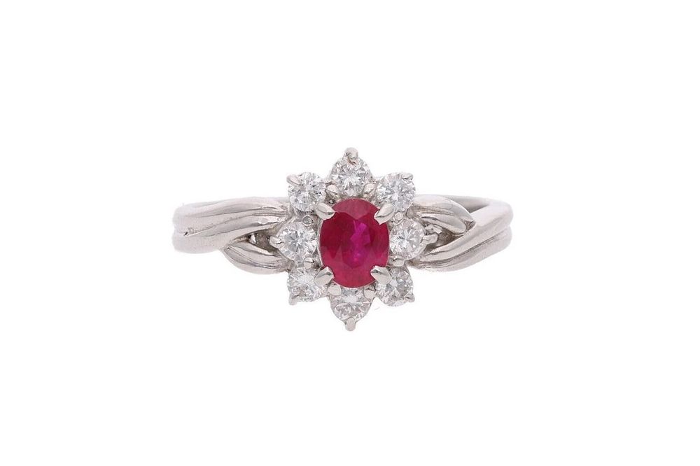 Lot 448: Platinum Ruby and Diamond Cluster Ring.