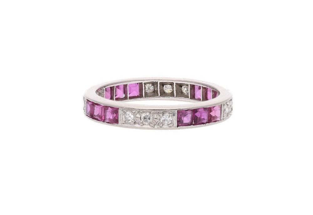 Lot 467: Platinum Ruby and Diamond Full Eternity Ring, Size 7.25 | O