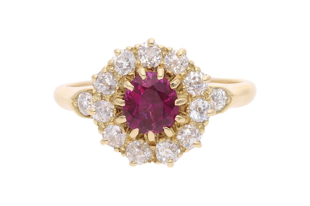 Lot 471: 18ct Gold Ruby and Diamond Cluster Ring.