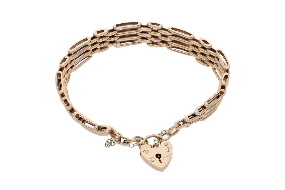Lot 531: 9ct Gold Heart Padlock Gate Bracelet.