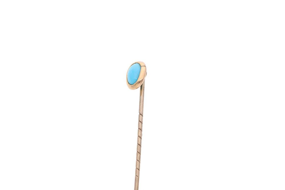 Lot 556: 9ct Gold and Turquoise Stick Pin.