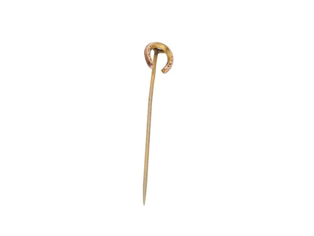 Lot 560: 9ct Gold Horseshoe Stick Pin.