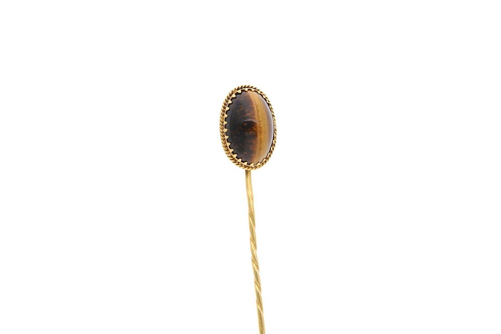 Lot 561: 9ct Gold and Tigers Eye Stick/Hat Pin