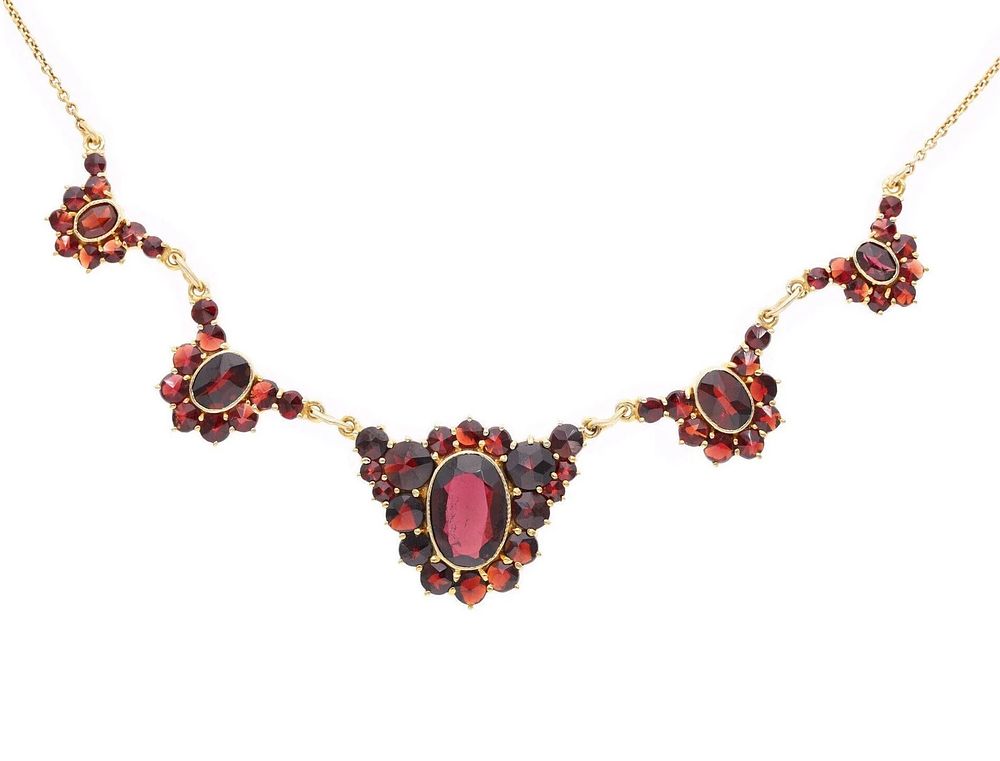Lot 571: 10ct Gold and Garnet Necklace.