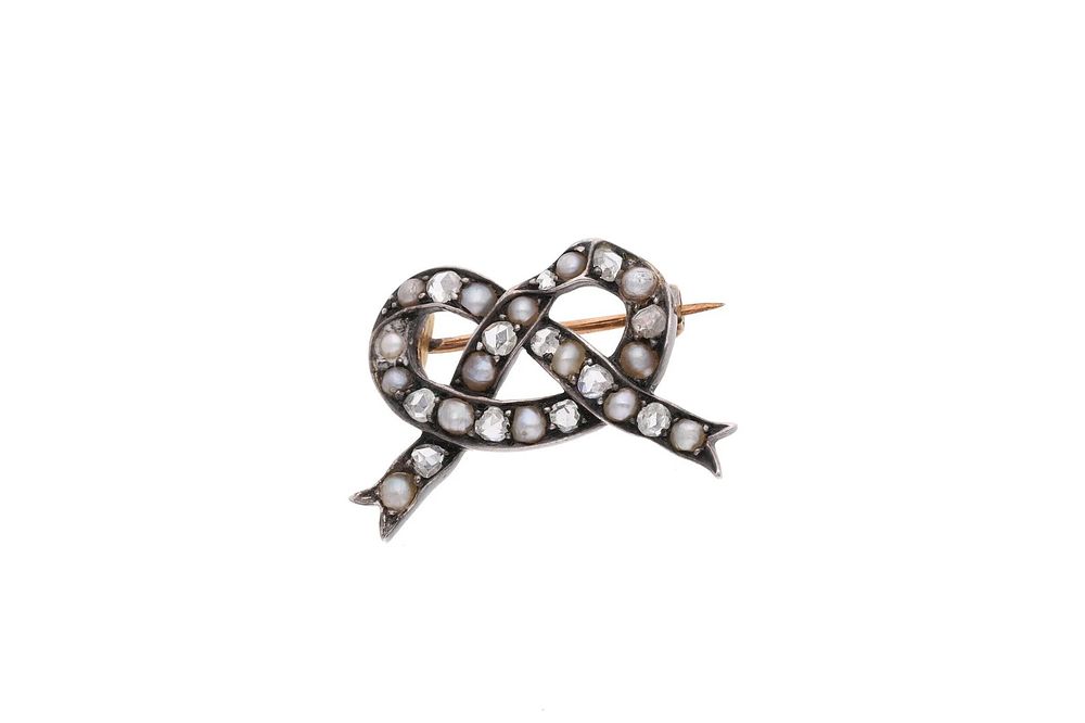 Lot 588: Antique Pearl and Diamond Bow tie Brooch.