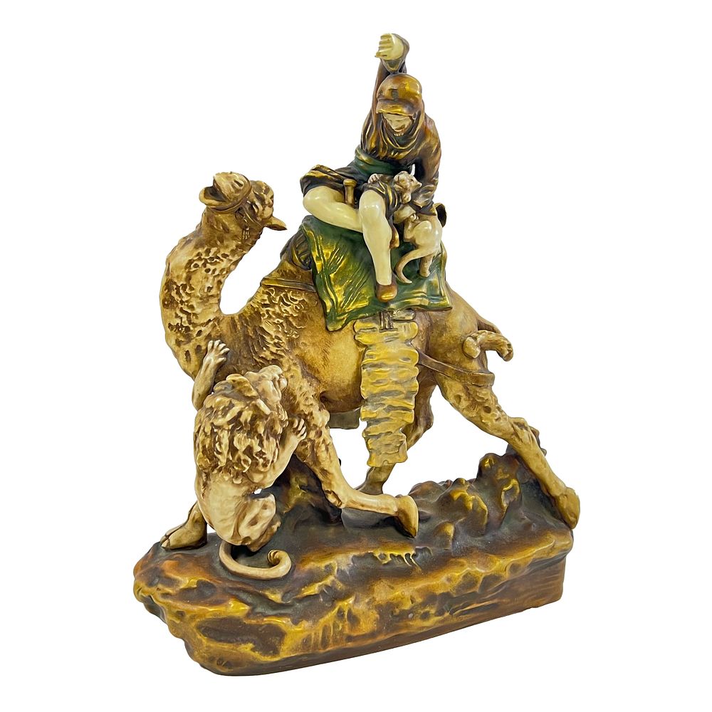 Lot 196: AN EARLY 20TH CENTURY ORIENTALIST PORCELAIN MODEL OF A LION HUNTER BY AMPHORA