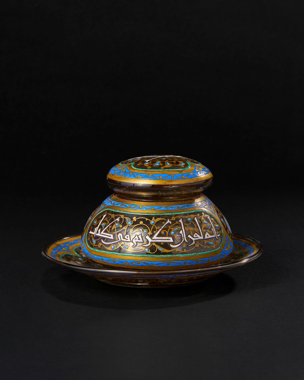 Lot 164: ISLAMIC ENAMELED GLASS JAR WITH UNDER PLATE, 19TH CENTURY