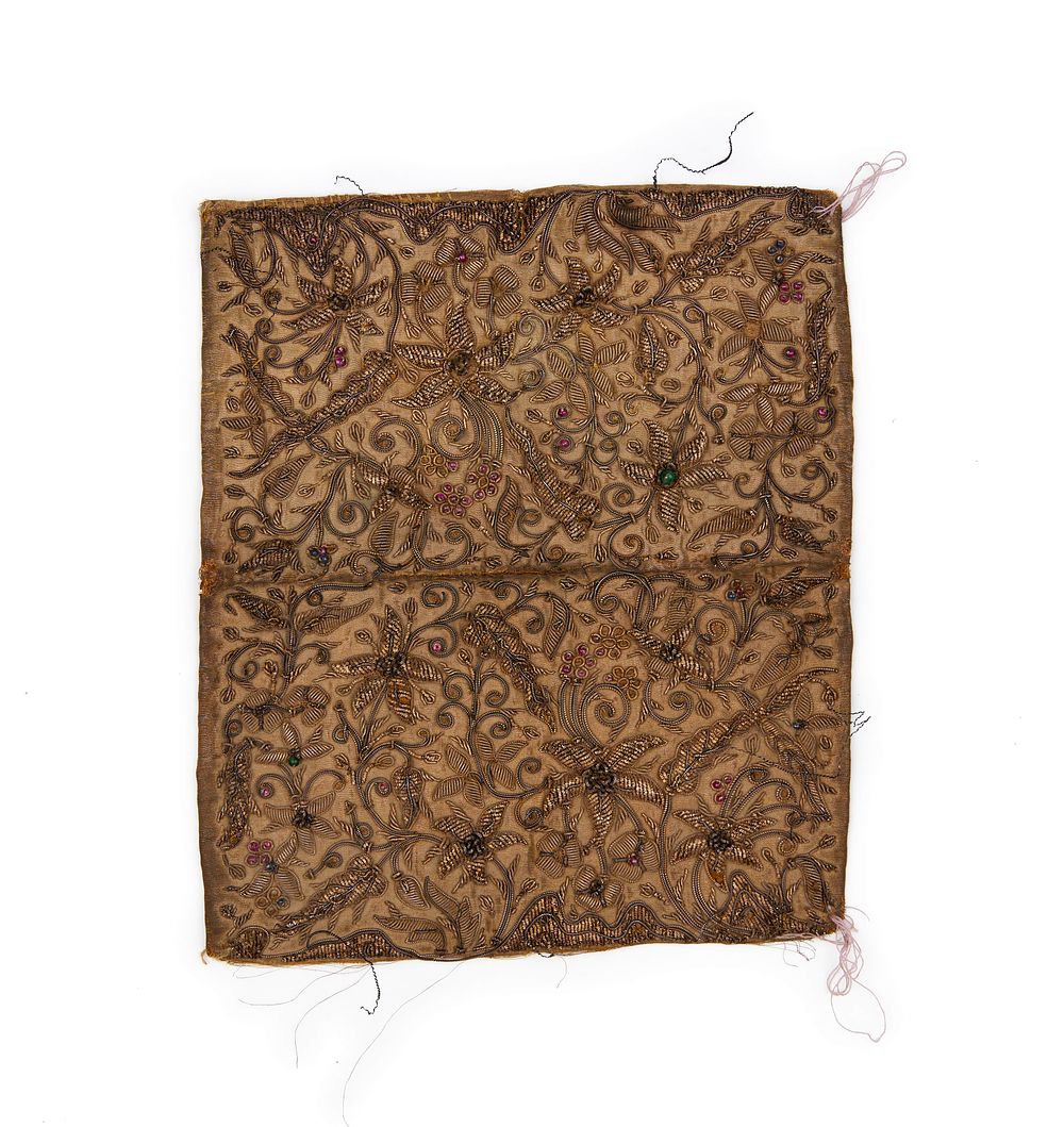 Lot 206: LEATHER BOOK BINDING COVER WITH GILDED METAL THREAD AND GEMS, MUGHAL, 18TH CENTURY