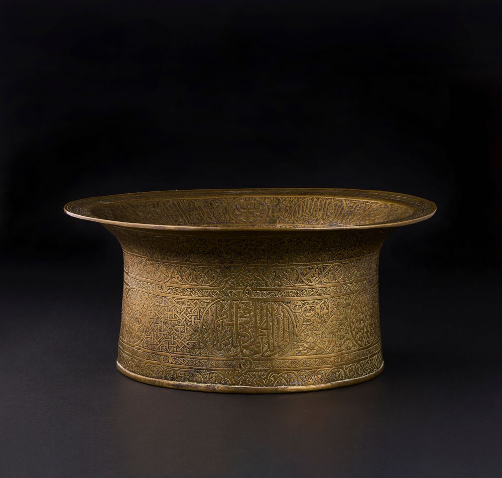 Lot 162: A MAMLUK ENGRAVED BRASS BASIN, EGYPT OR SYRIA, EARLY 16TH CENTURY