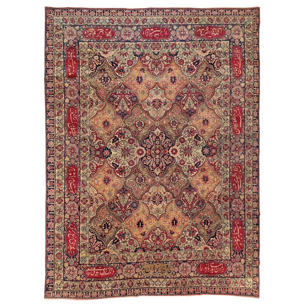 Lot 211: A LARGE SIGNED KERMAN RAVER CARPET