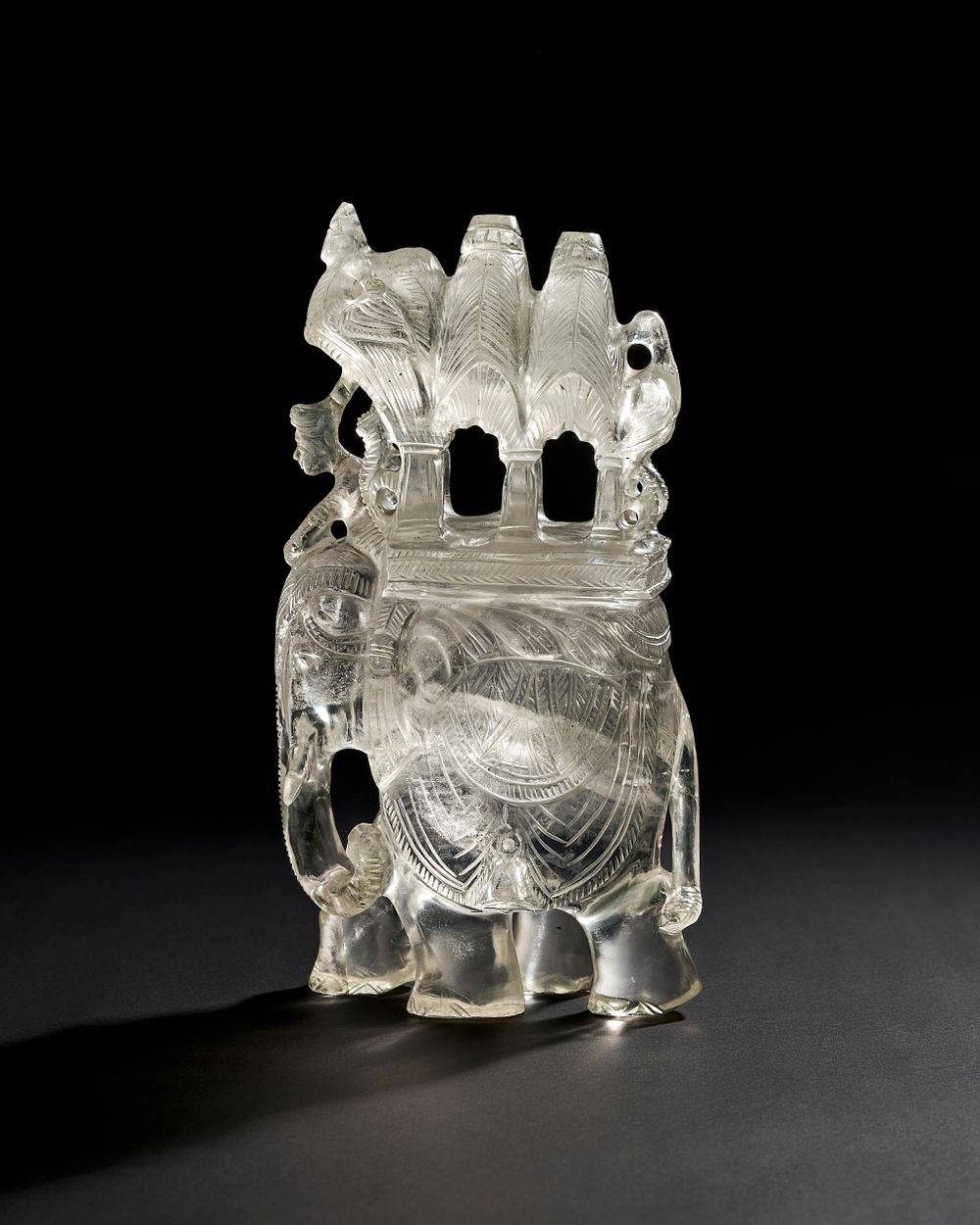 Lot 201: A LARGE 19TH CENTURY INDIAN CARVED ROCK CRYSTAL ELEPHANT WITH HOWDAH AND RIDER