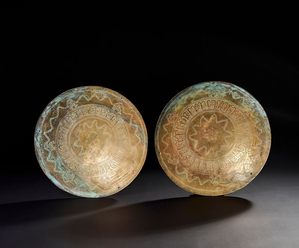 Lot 171: A PAIR OF 10TH-11TH CENTURY PERSIAN GHAZNAVID ENGRAVED BRONZE SCALES DISHES