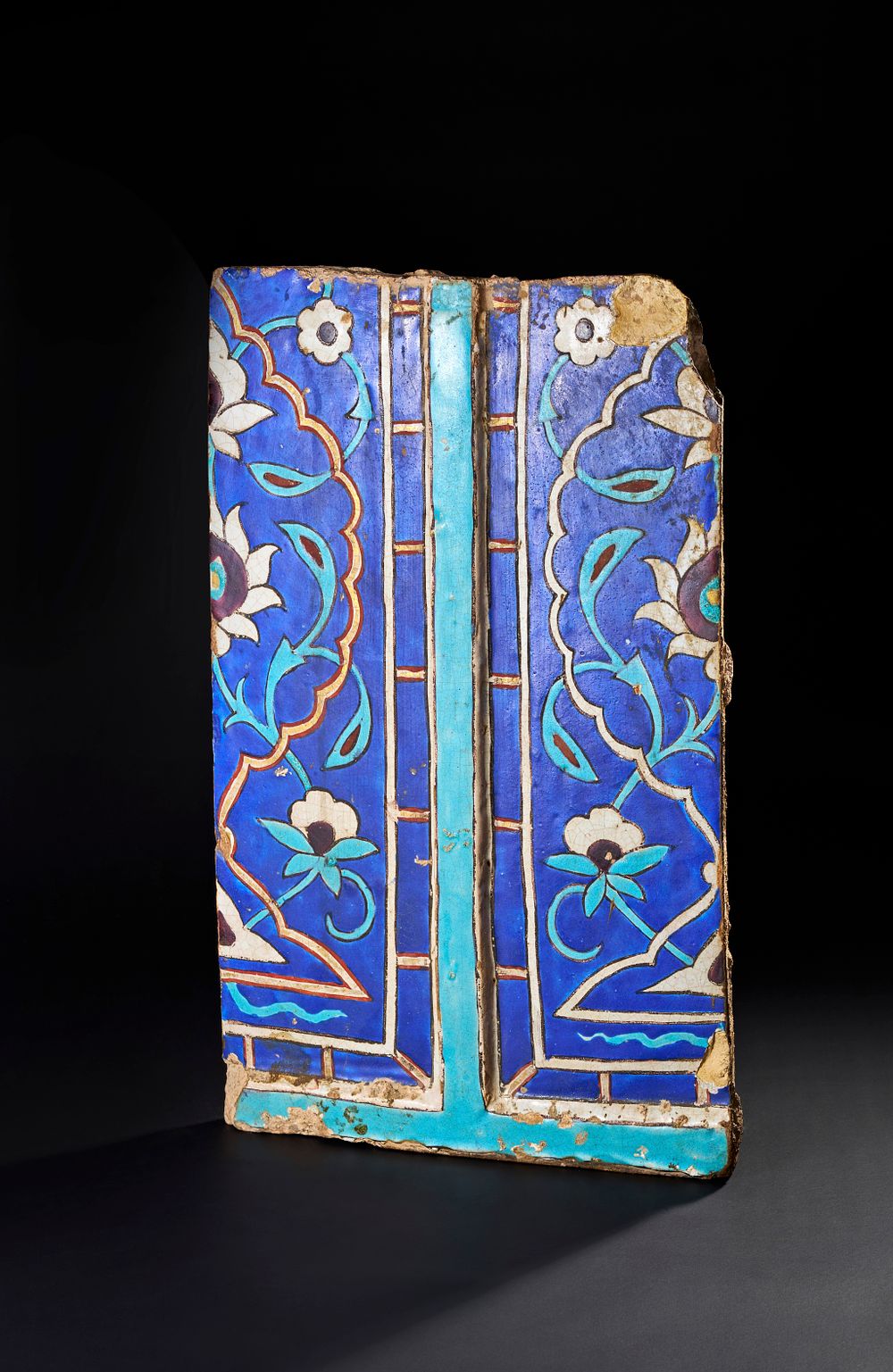 Lot 156: A RARE LARGE 15TH CENTURY PERSIAN OR CENTRAL ASIAN TIMURID CUERDA SECA GLAZED TILE WITH GILDED DECORATION