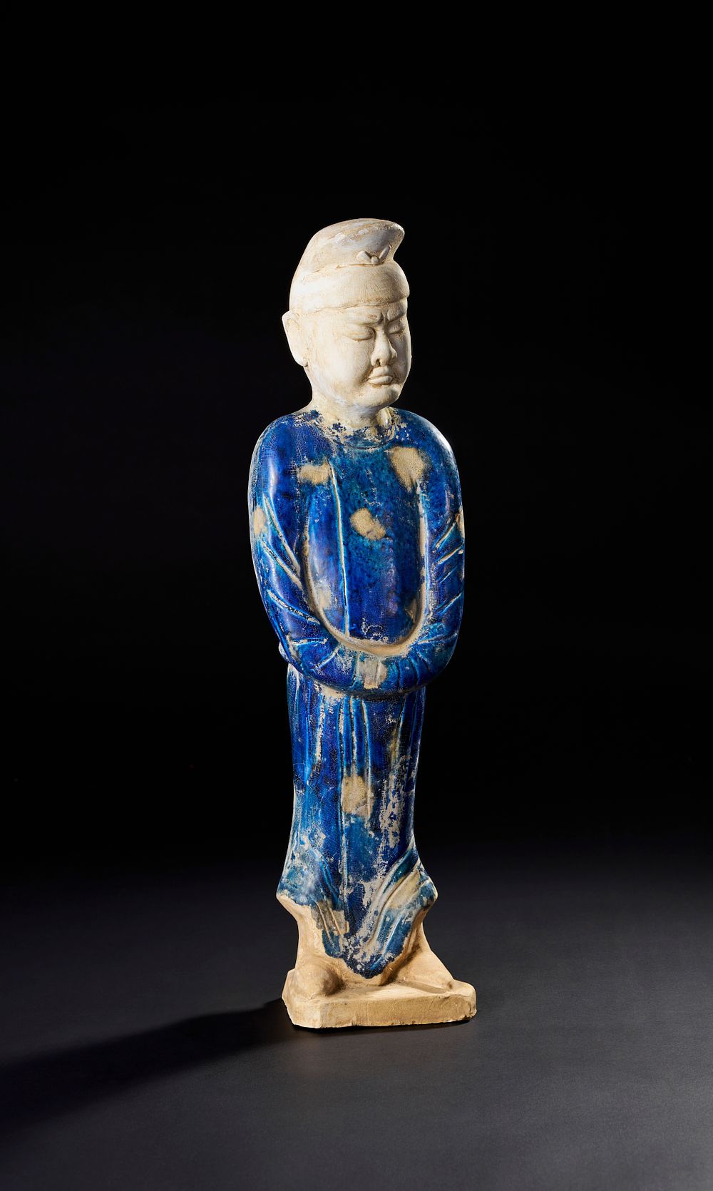 Lot 217: A CHINESE BLUE GLAZED POTTERY FIGURE, HAN DYNASTY