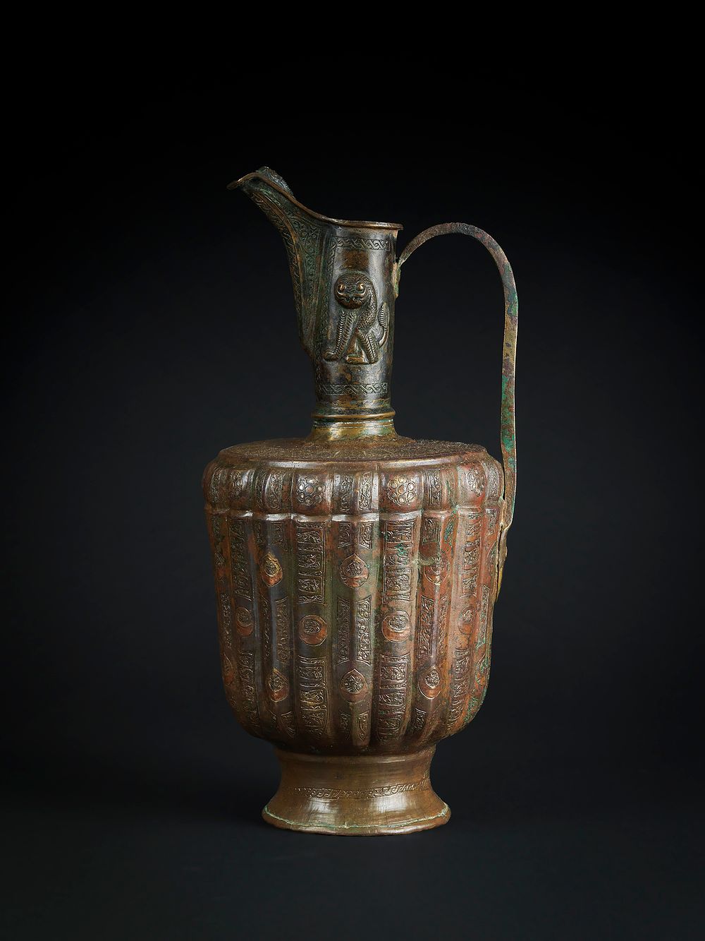 Lot 228: A KHORASAN SILVER AND COPPER INLAID BRONZE EWER, PERSIA, 12TH CENTURY