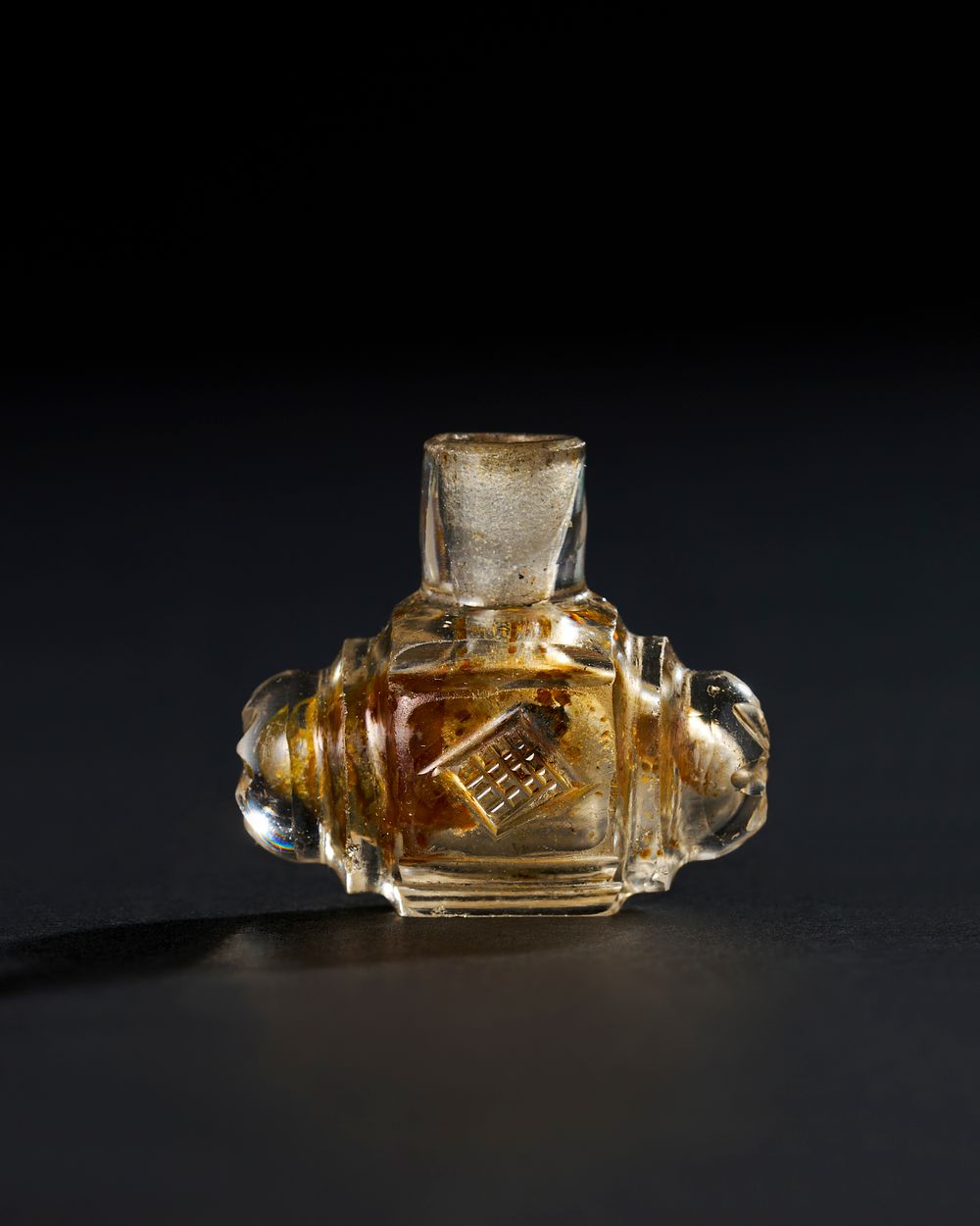 Lot 271: A FATIMID ROCK CRYSTAL FLASK, PROBABLY EGYPT OR SYRIA, 9TH - 10TH CENTURY