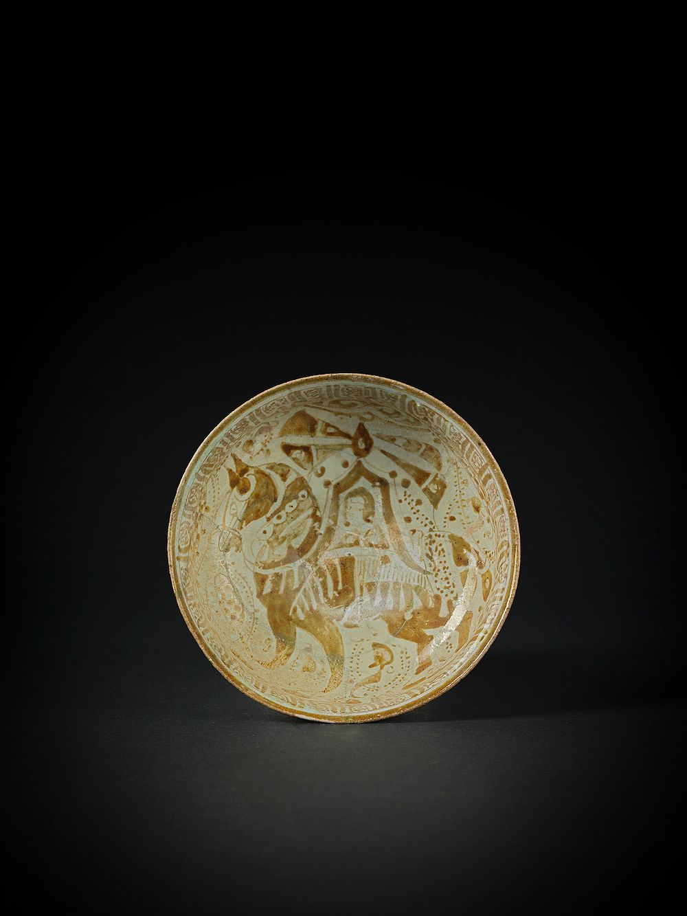 Lot 159: A KASHAN LUSTRE BOWL DEPICTING A HORSE AND RIDER, PERSIA, 12TH/ 13TH CENTURY