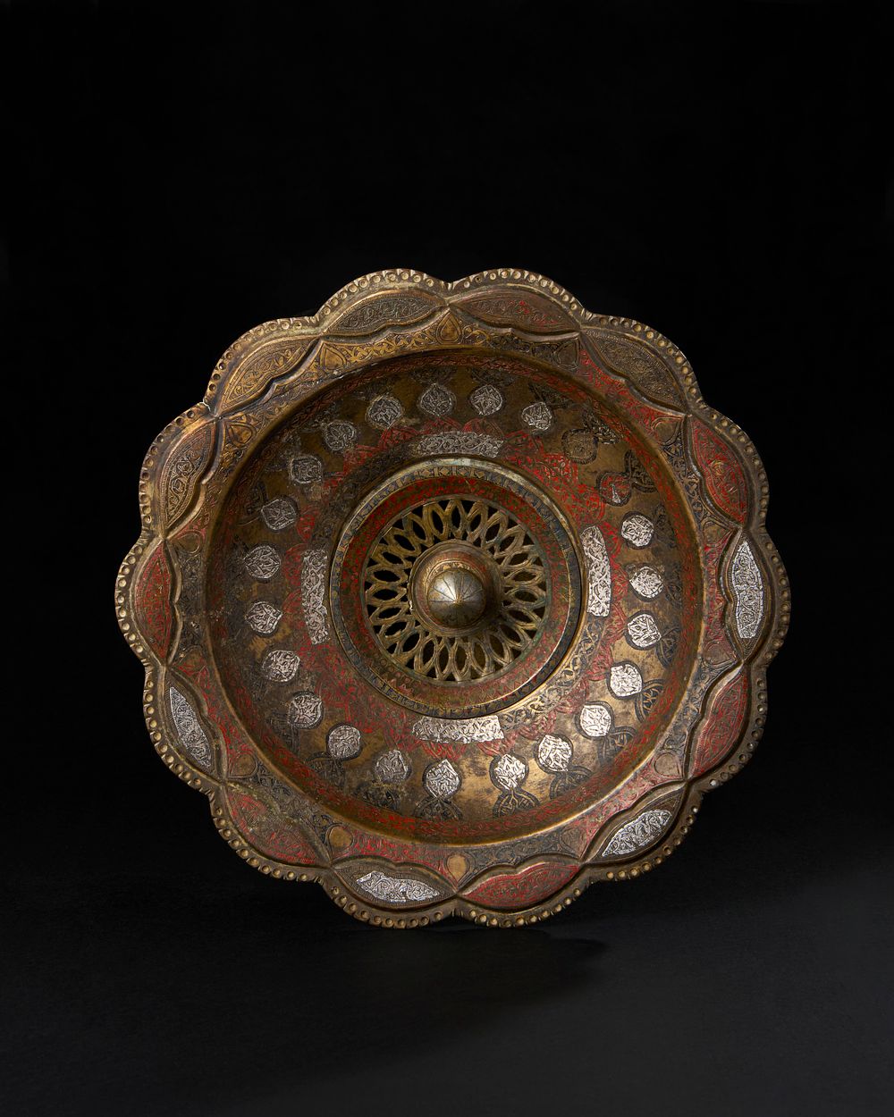 Lot 215: AN ENAMELLED AND SILVER INALID BRASS WASH BASIN (DASHSHUI), PROBABLY KOKAND, UZBEKISTAN, 19TH CENTURY