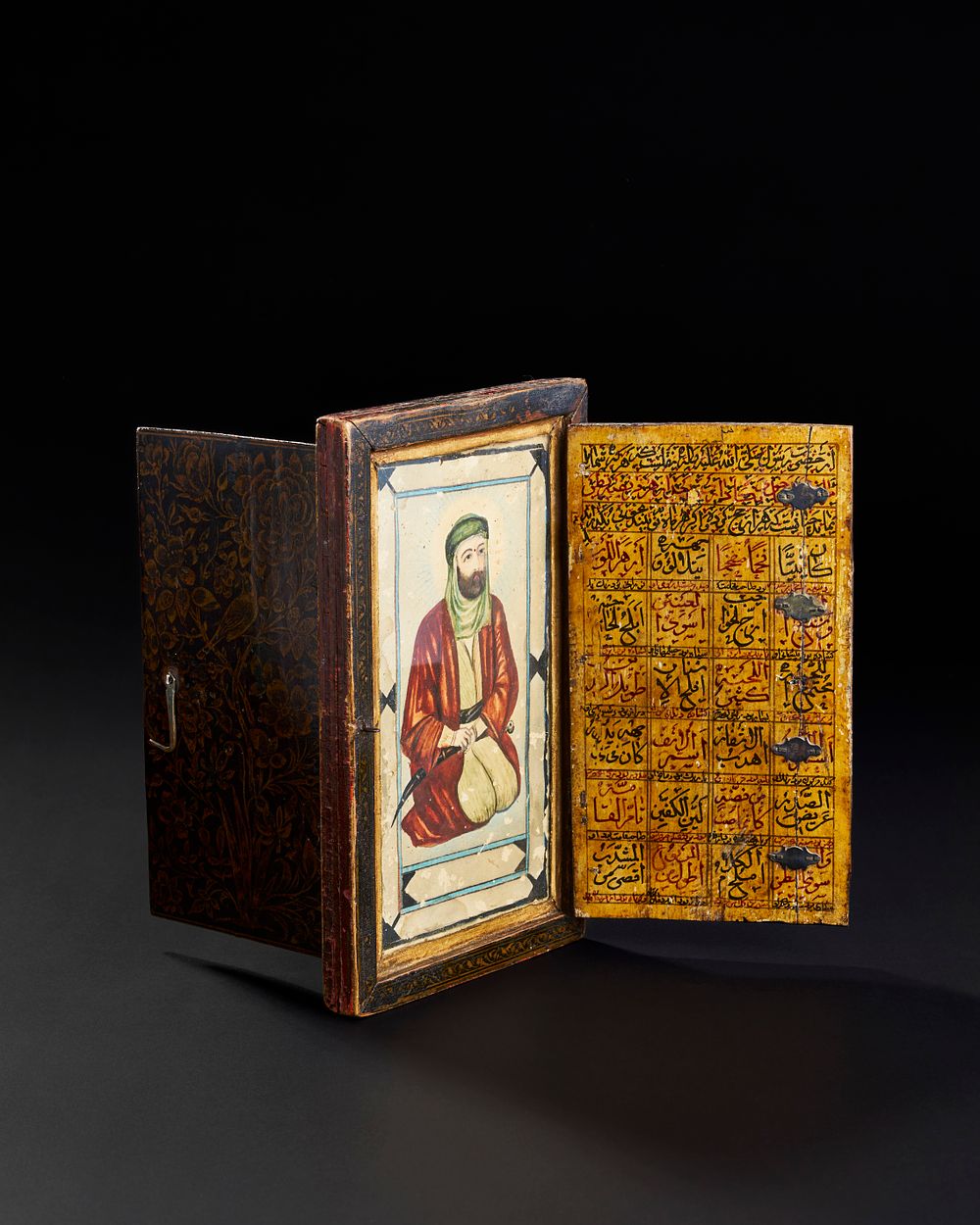 Lot 287: A RARE LATE SAFAVID PAINTED AND LACQUERED WOODEN DOUBLE SIDED ICON DEPICTS IMAM ALI, PERSIA, 18TH CENTURY