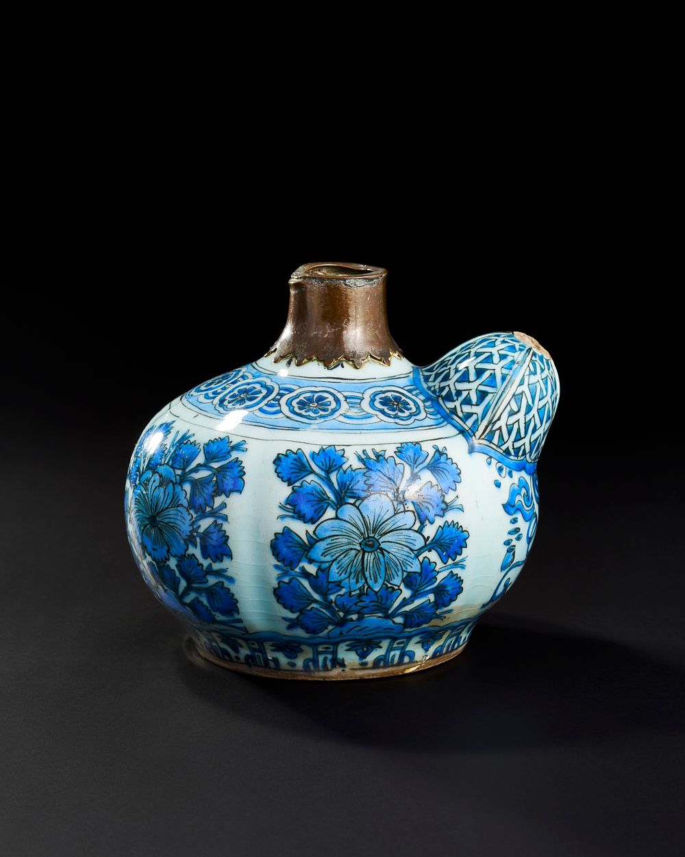 Lot 301: A 17TH CENTURY SAFAVID PERSIAN GALZED POTTERY KENDI