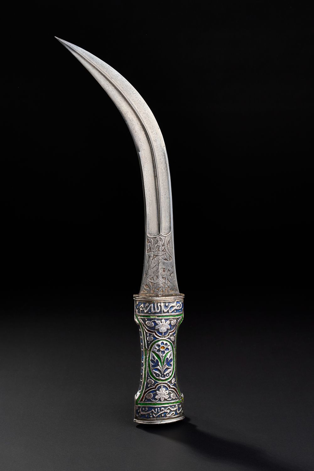 Lot 183: A QAJAR ENAMELLED SILVER DAGGER WITH ENGRAVED WATERED STEEEL (WOOTZ) BALDE, PERSIA, 19TH CENTURY