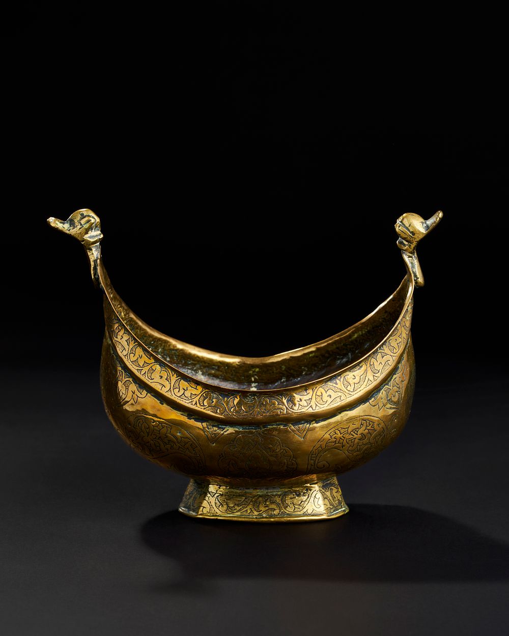 Lot 306: AN ENGRAVED BRASS KASHKUL, BUKHARA CENTRAL ASIAN, 19TH CENTURY