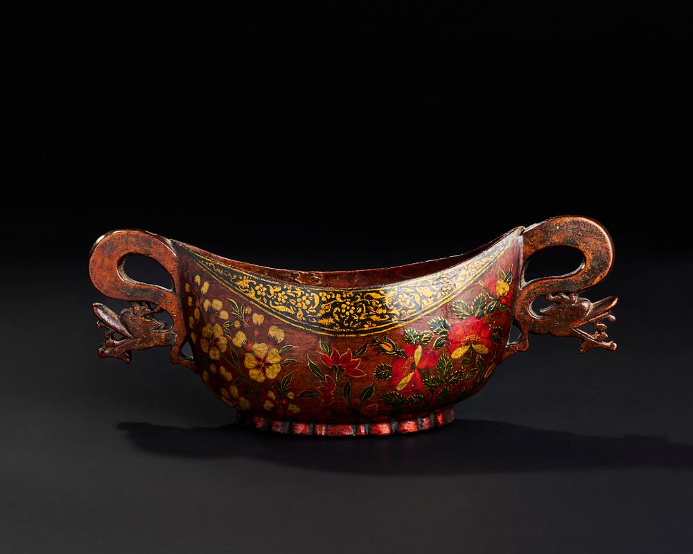 Lot 307: A 19TH CENTURY PERSIAN QAJAR PAINTED AND LACQUERED WOOD KASHKUL BOWL