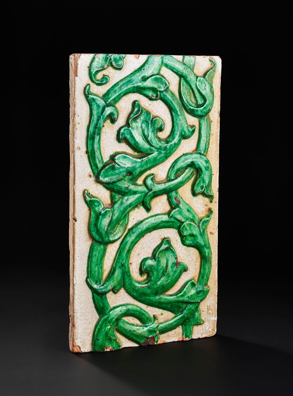 Lot 158: A LARGE MOULDED INDIAN POTERY TILE, 19TH CENTURY