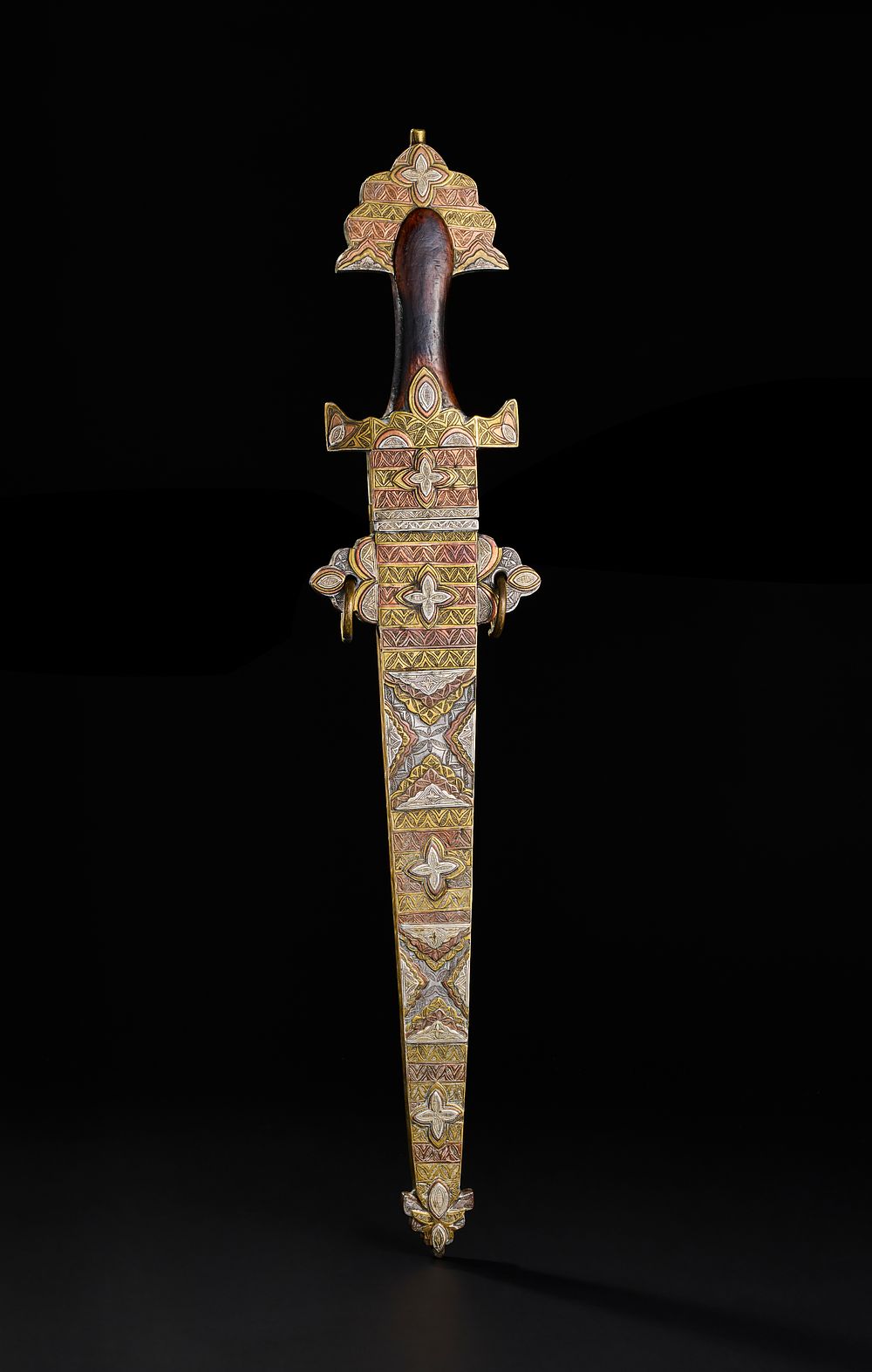 Lot 194: A LARGE NORTH AFRICAN TUAREG SILVER, COPPER AND BRASS INALID SWORD, 19TH CENTURY