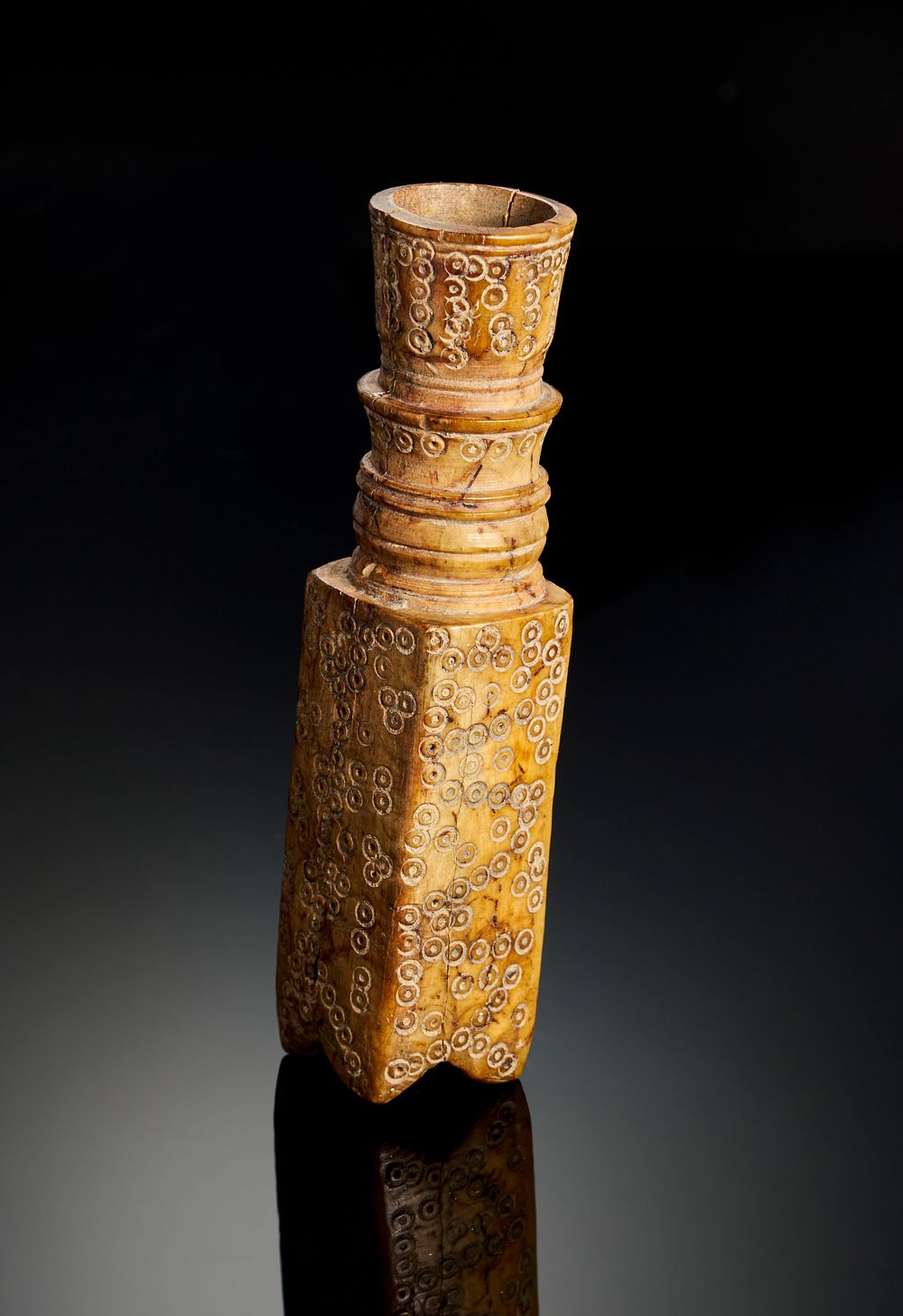 Lot 316: A FATIMID ENGRAVED BONE PERFUM BOTTLE, EGYPT OR SYRIA, 10TH-11TH CENTURY