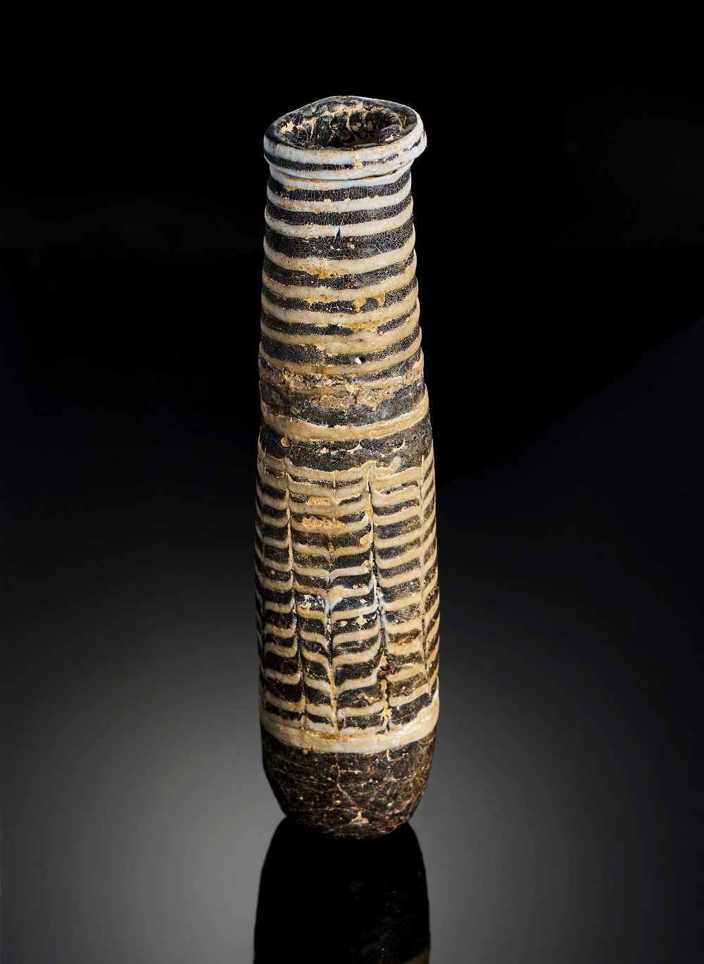 Lot 269: A MAMLUK MEDICAL GLASS FLASK, EGYPT OR SYRIA, 13TH-15TH CENTURY