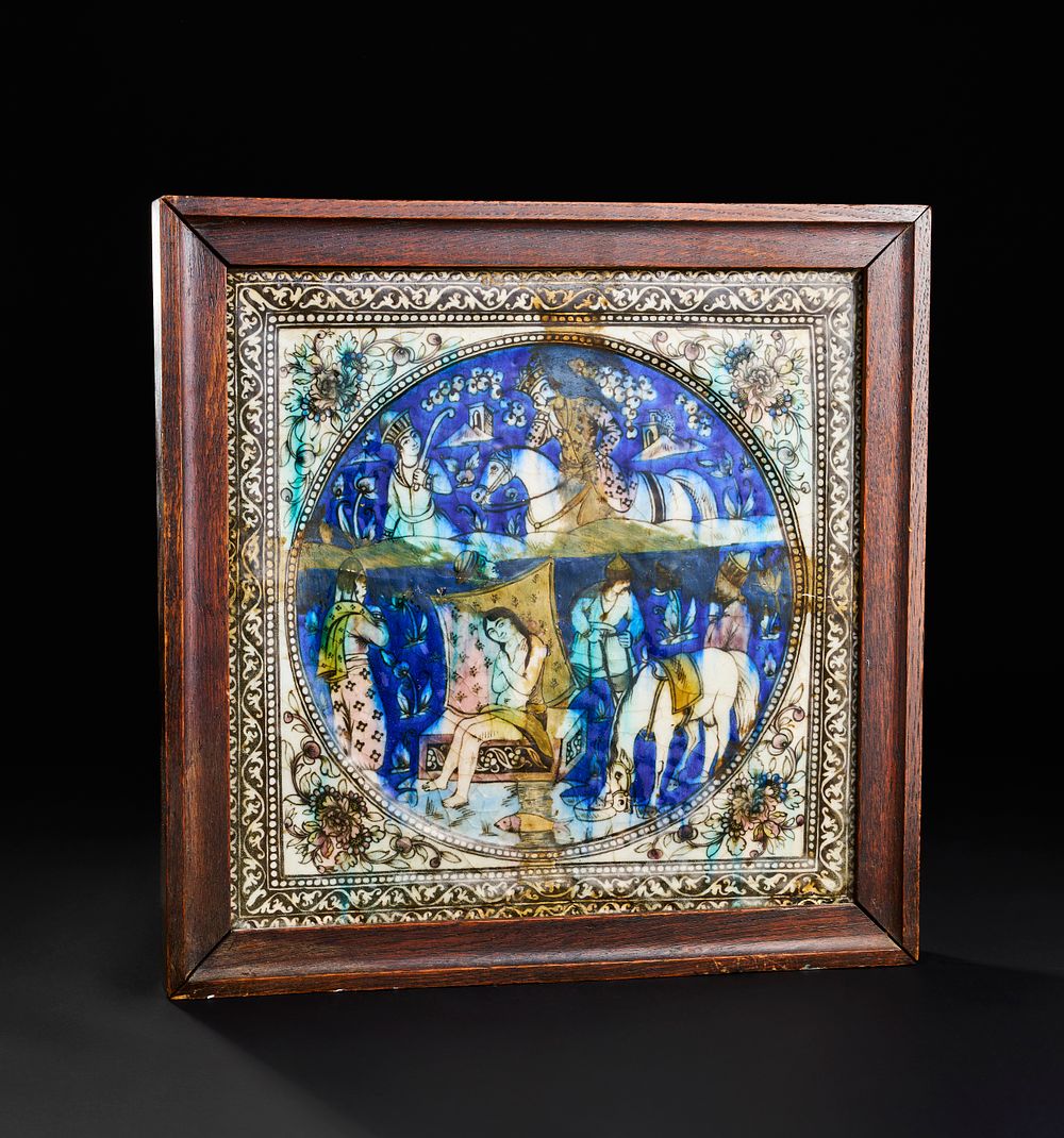 Lot 167: A LARGE QAJAR MOULDED POTTERY TILE, PERSIA, 19TH CENTURY