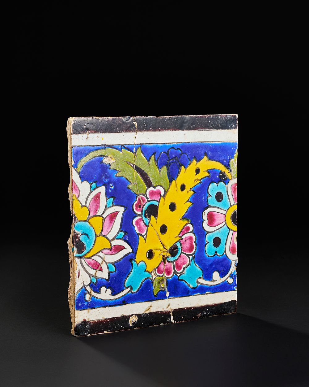 Lot 157: A QAJAR POTTERY TILE, 19TH CENTURY
