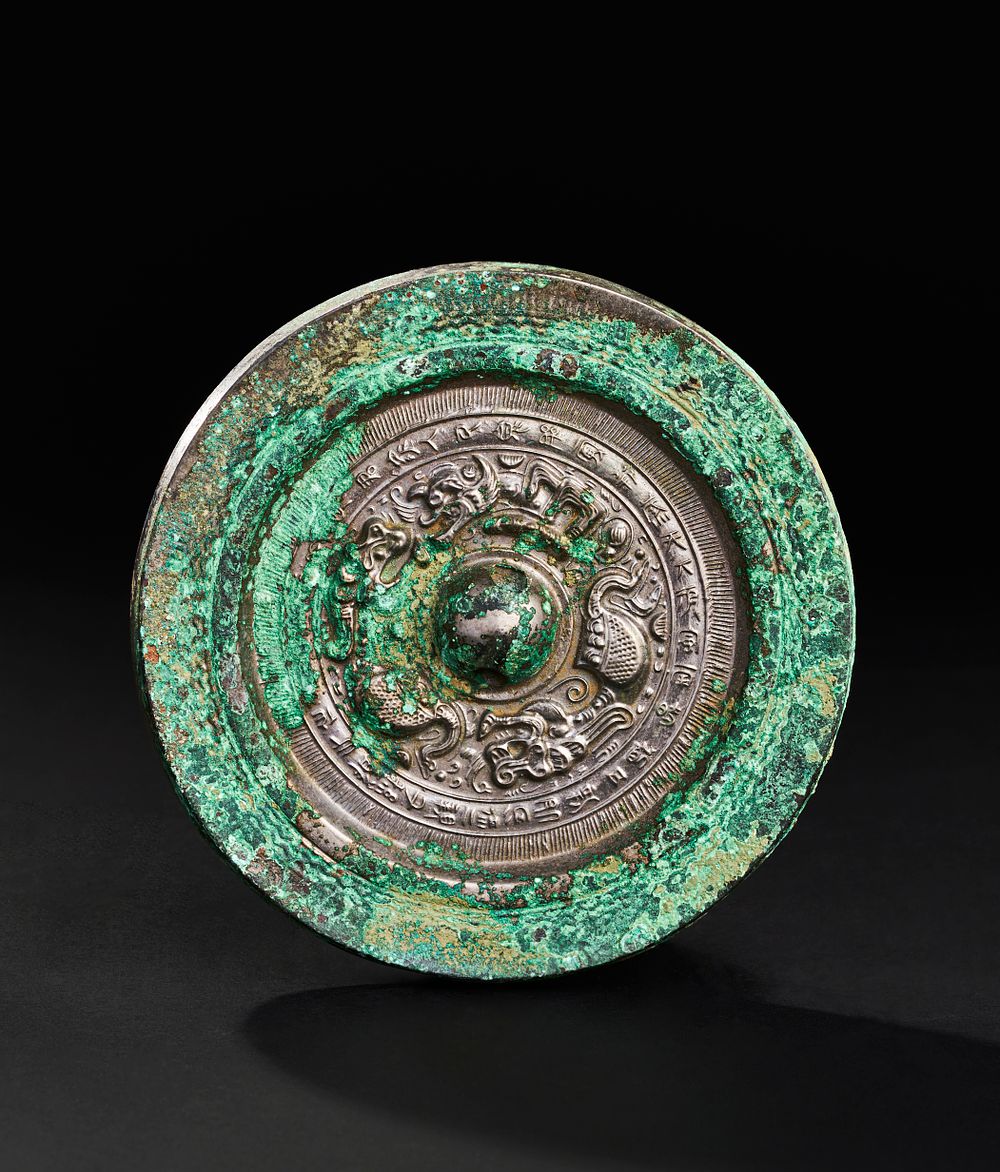 Lot 259: A ROUND BRONZE CHINESE MIRROR, TANG DYNASTY