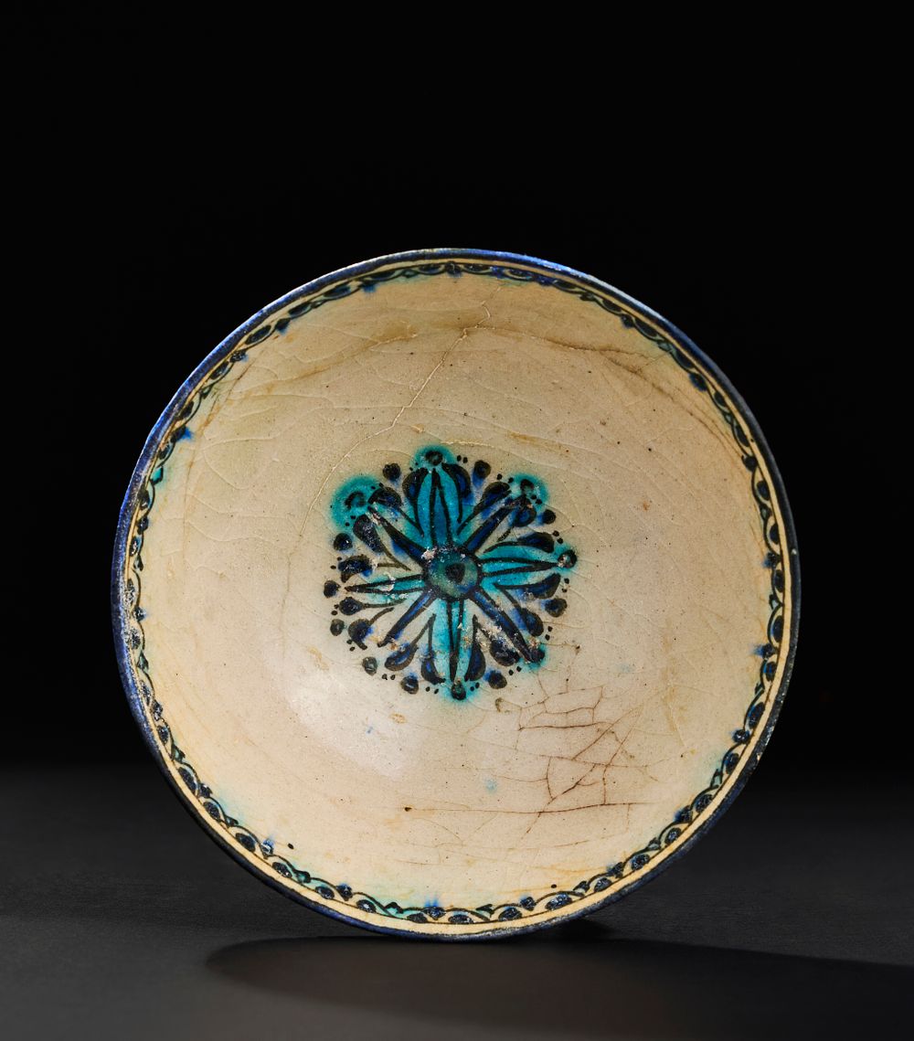 Lot 200: A POTTERY BOWL FROM KASHAN, PERSIA, EARLY 13TH CENTURY