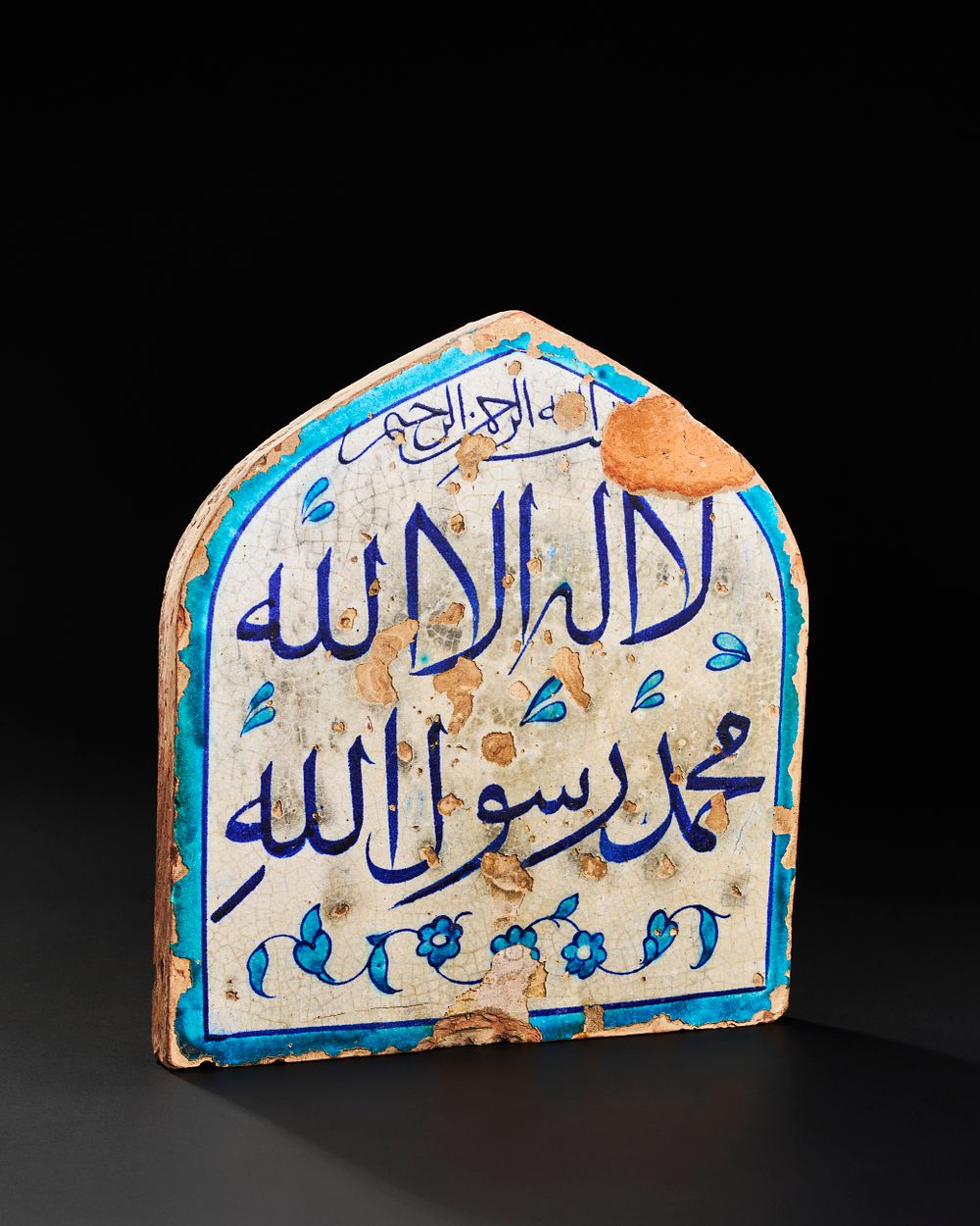 Lot 162: A NORTH INDIAN MULTAN CALLIGRAPHIC TILE DEPICTING THE SHAHADA, 18TH CENTURY