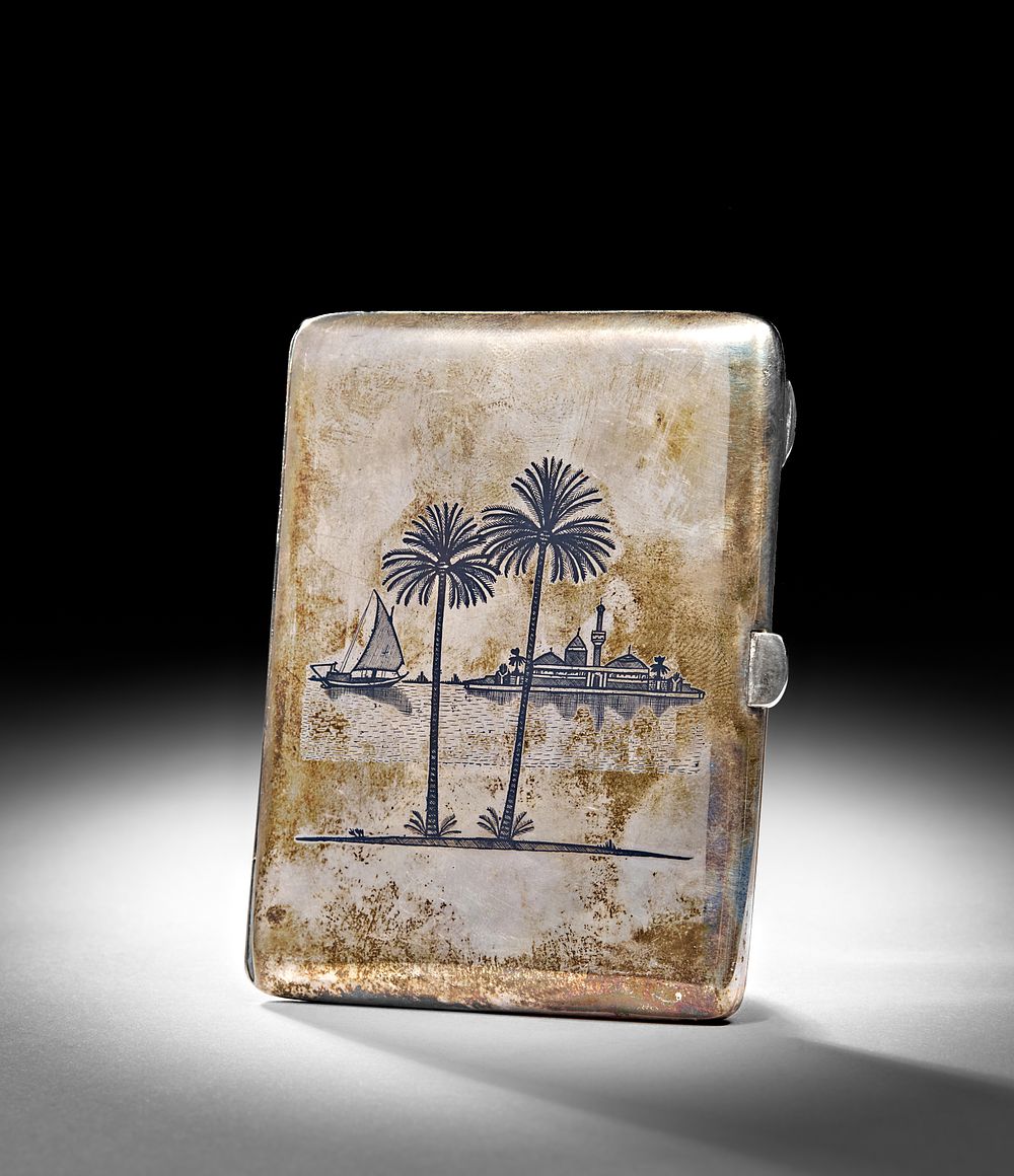Lot 230: AN IRAQI SILVER AND NIELLO CIGARETTE CASE, 20TH CENTURY